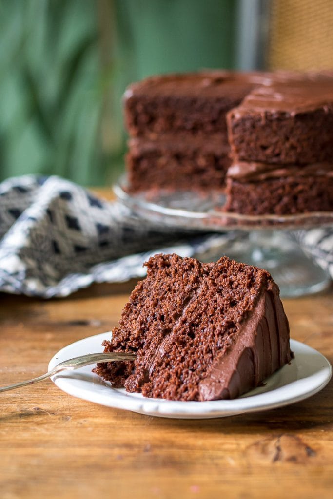 Slice of cake on a plate with a fork.