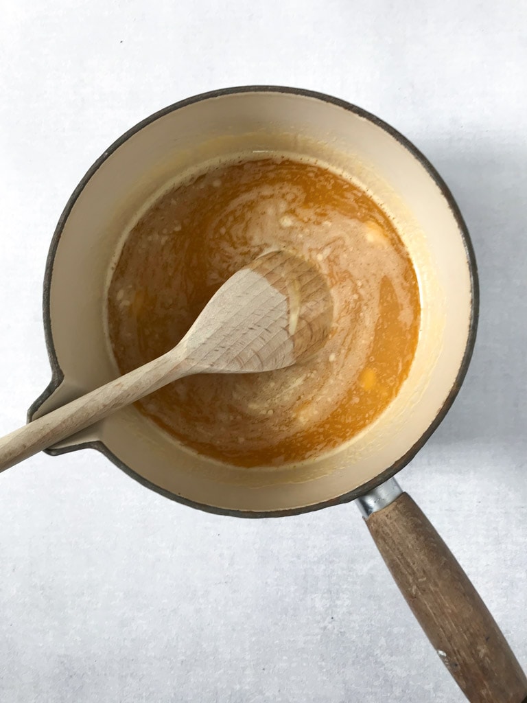 Pot with melted butter and syrup