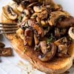 Mushrooms on toast with a fork.