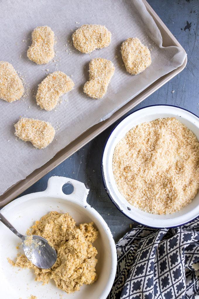 Making chickpea nuggets, with breadcrumbs.