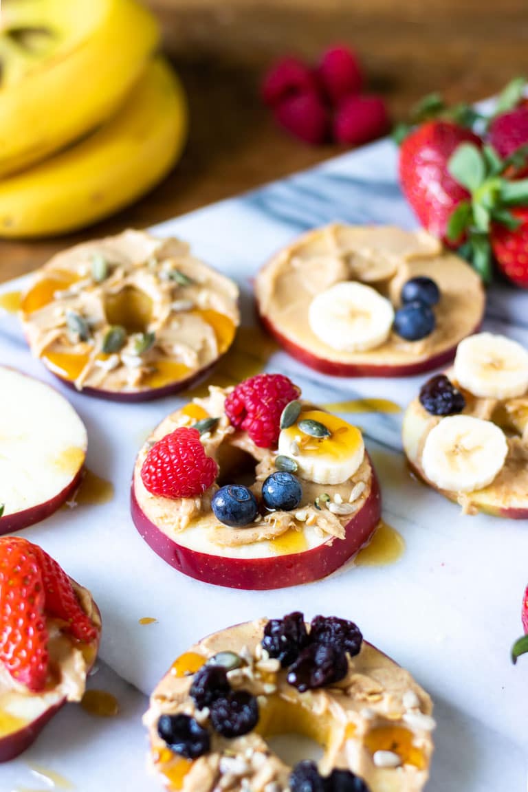 Sliced apples topped with fruit.