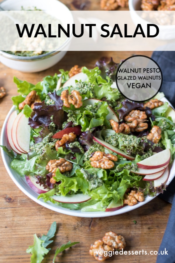 This apple walnut salad has a tasty walnut pesto dressing. It's then sprinkled with easy rosemary maple glazed walnuts. It's a delicious vegan salad recipe that's great for dinner or a side dish. #walnutsalad #glazedwalnuts #applesalad