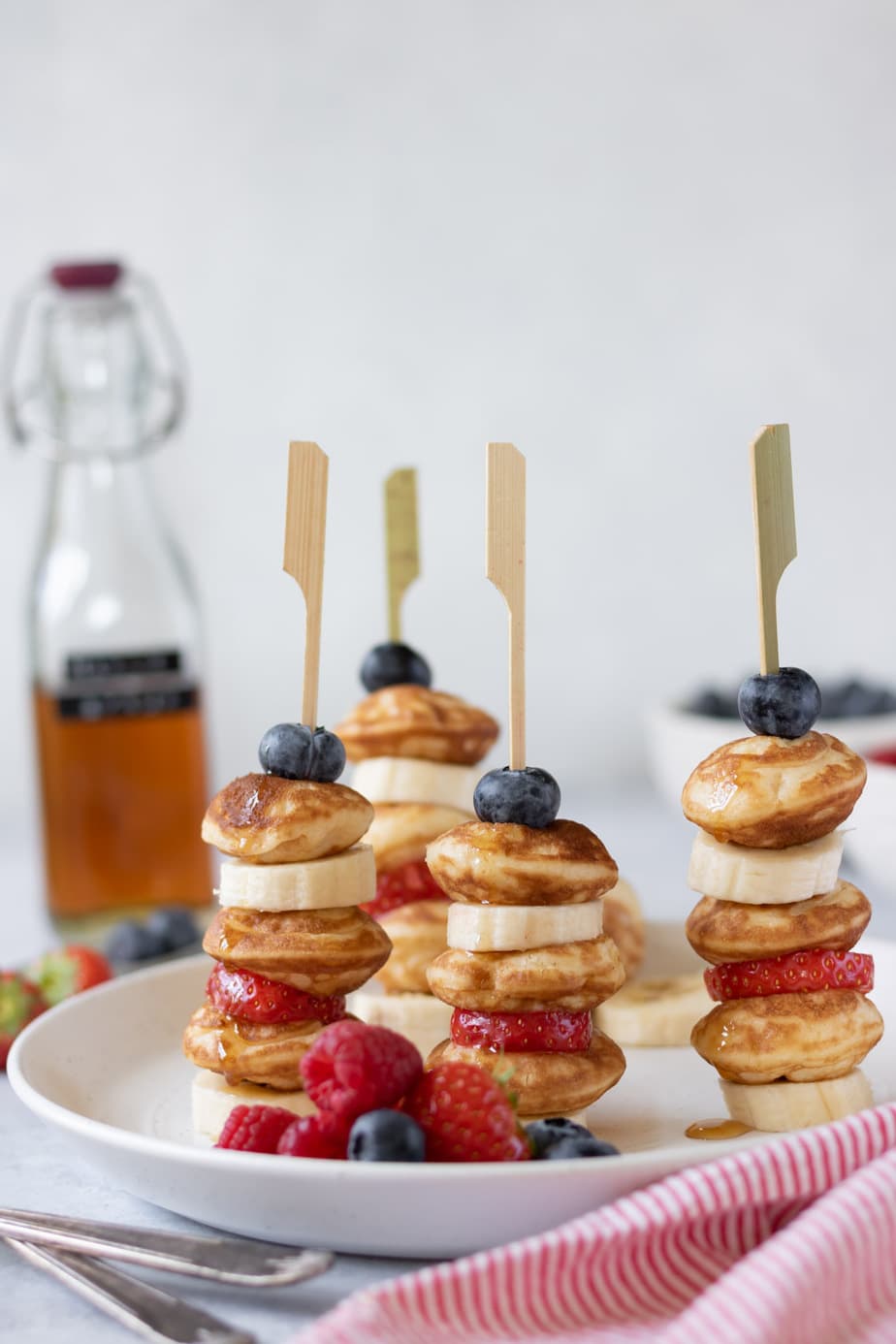 Sticks of pancakes, strawberries, bananas and blueberries - a fun breakfast recipe.