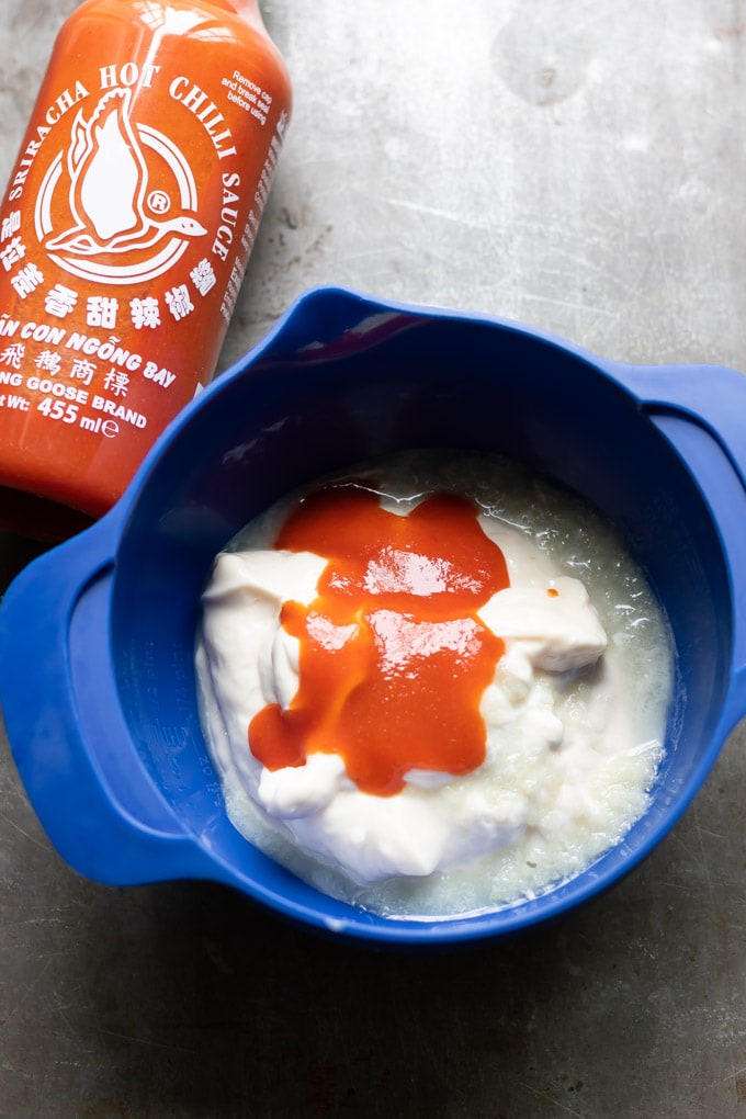In a bowl with mayo and sriracha.