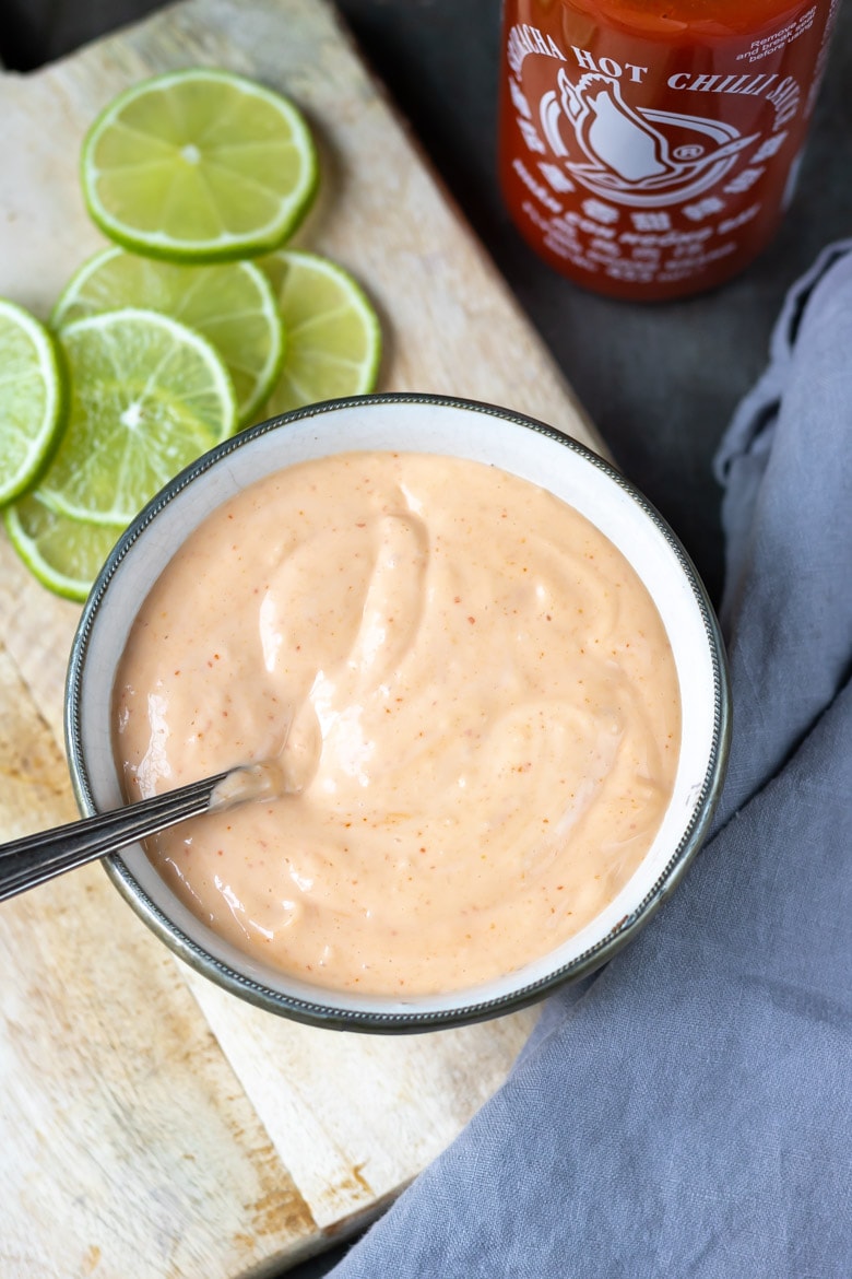 Close up of a bowl of sriracha aioli.