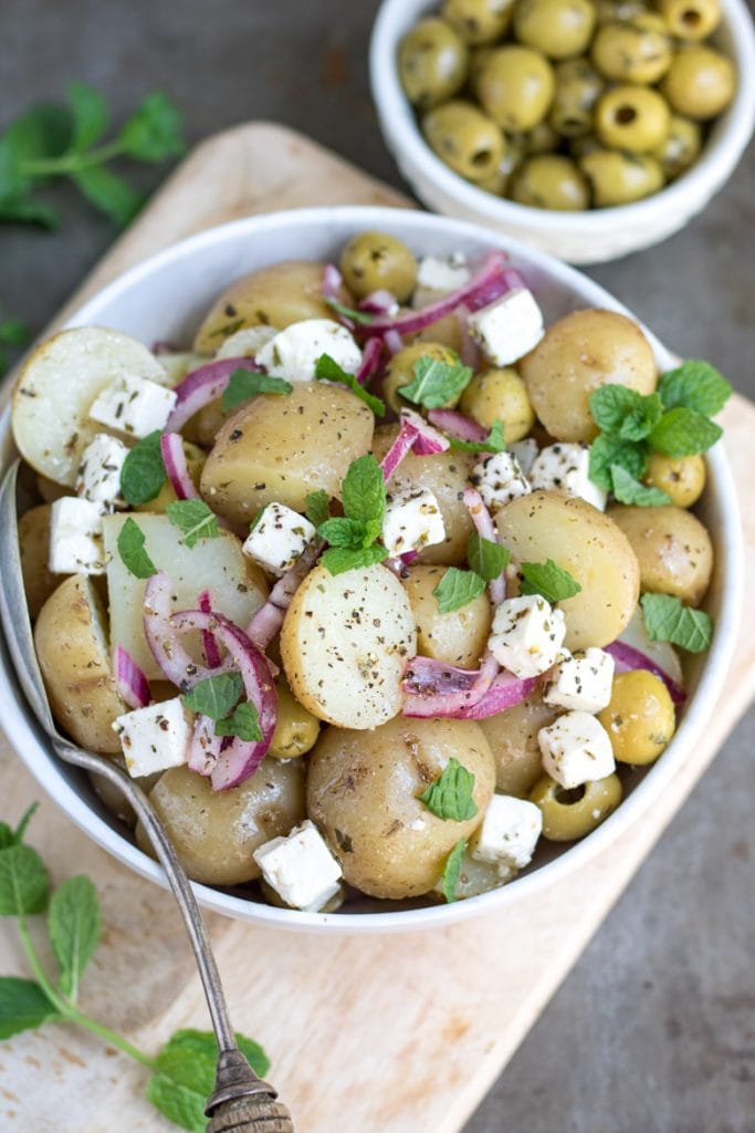 Close up of a bowl of Greek potato salad.