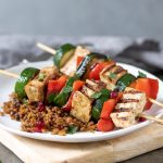 Tofu and Vegetable Kabobs on a plate of rice