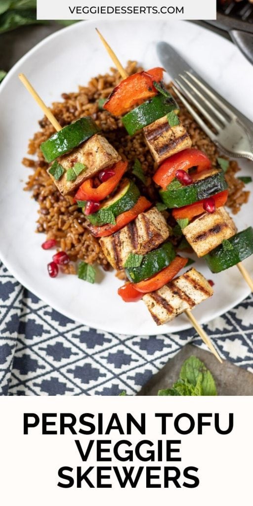 Tofu veg skewers on a plate, text overlay for pinterest