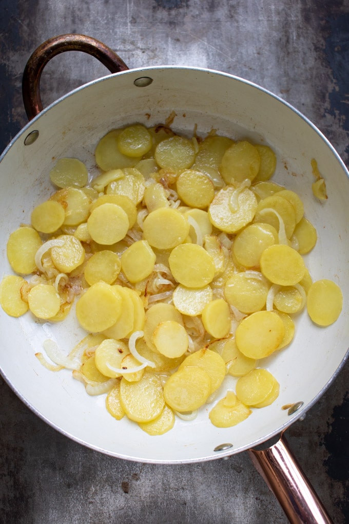 Skillet of cooked potatoes and onions