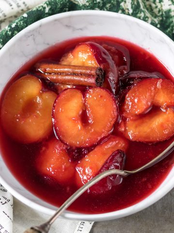 Bowl of cooked plums.