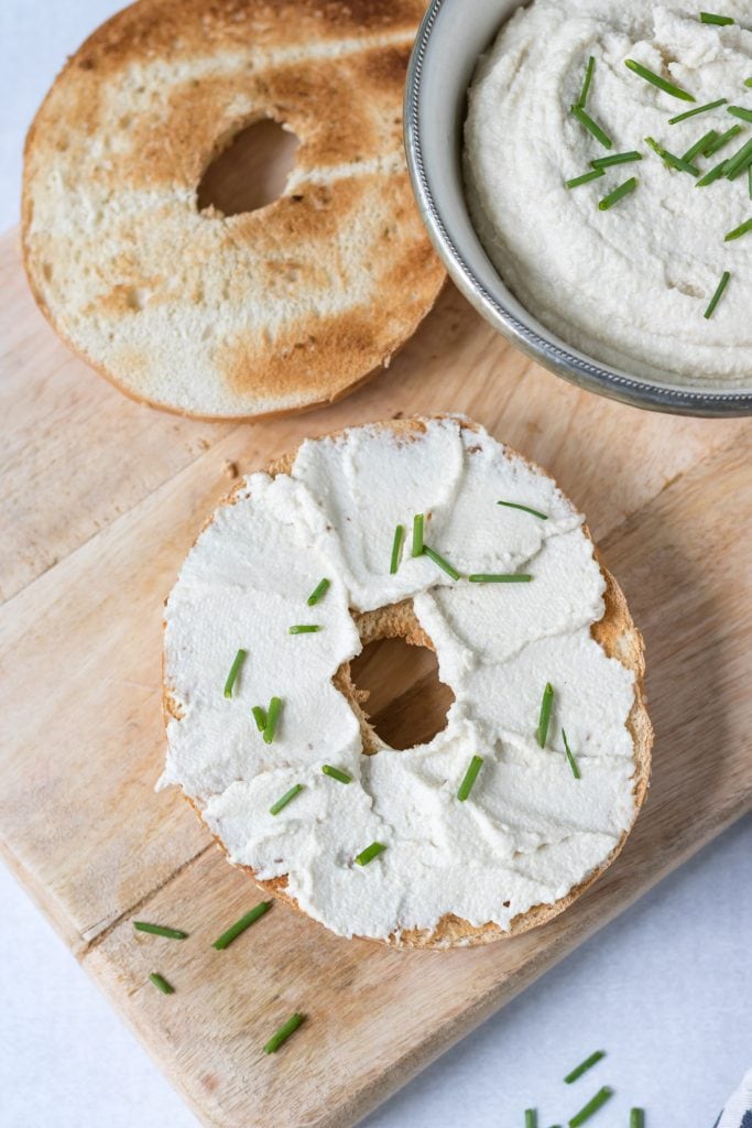 Bagel with cream cheese and chives.