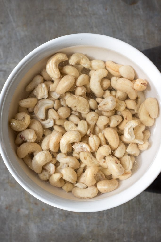 Cashews in a bowl of water.