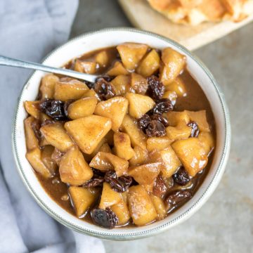 Bowl of apple compote with raisins.