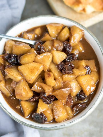 Bowl of apple compote with raisins.