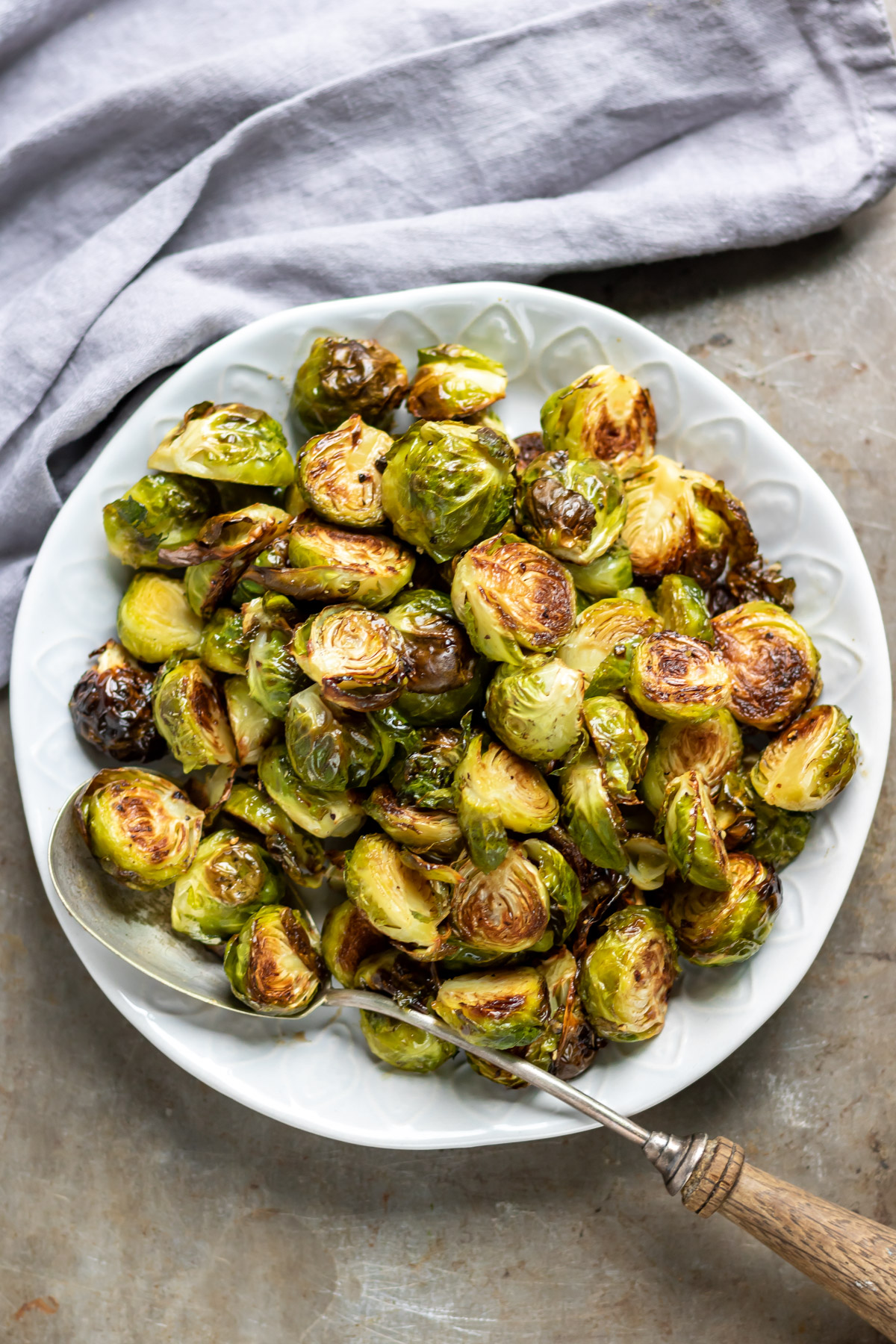 Close up of a serving plate of roasted sprouts.