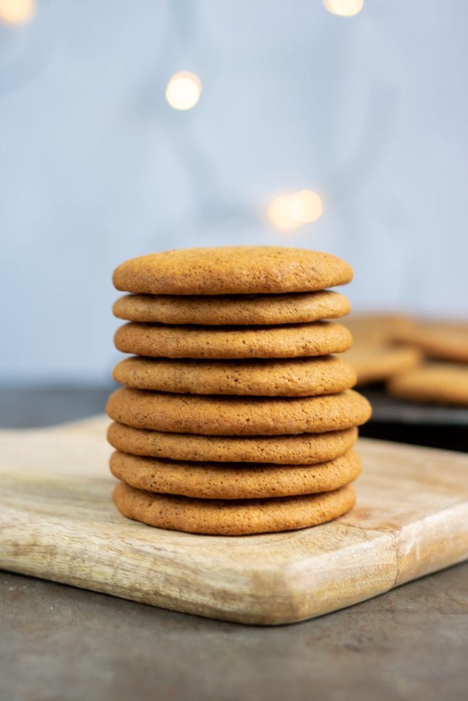 Stack of cookies on a board.