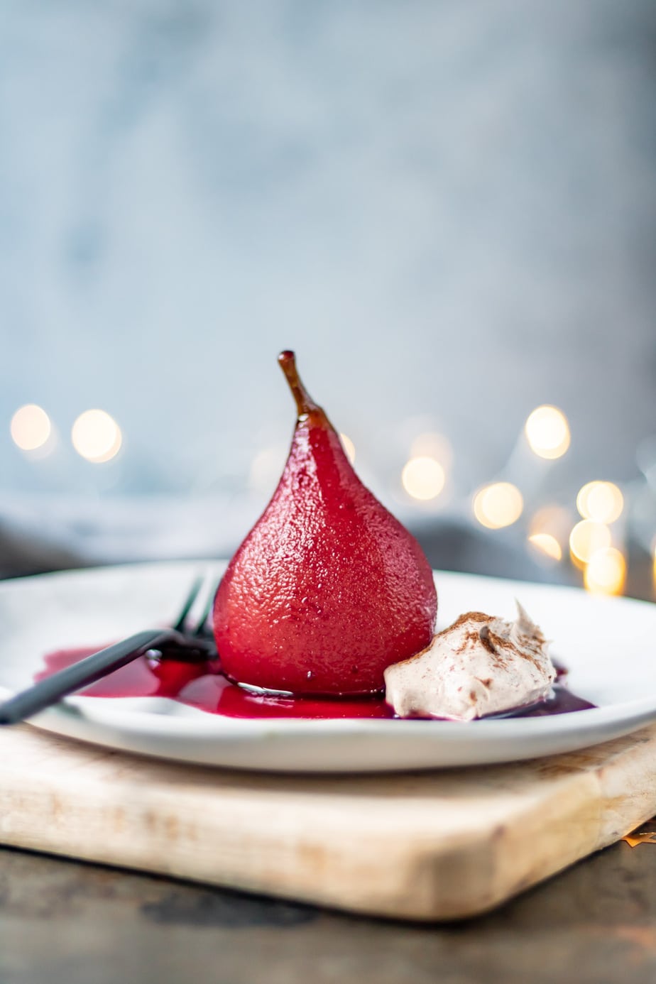 Poached pear on a plate.