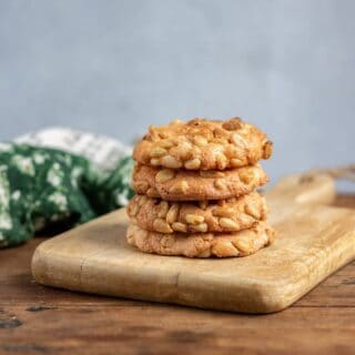 Stack of cookies on a board.