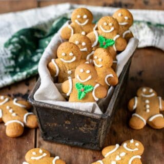 Box full of decorated gingerbread men.