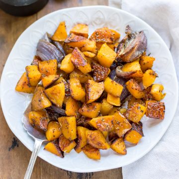 Bowl of roasted squash with maple syrup.