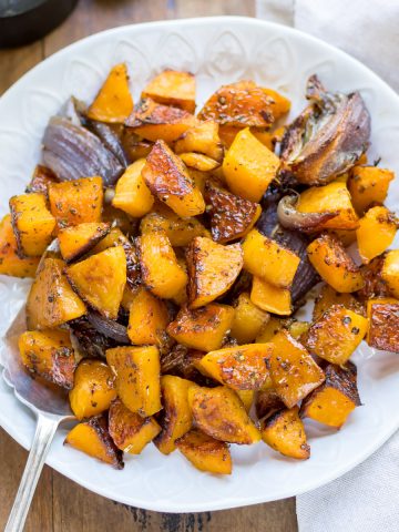 Bowl of roasted squash with maple syrup.