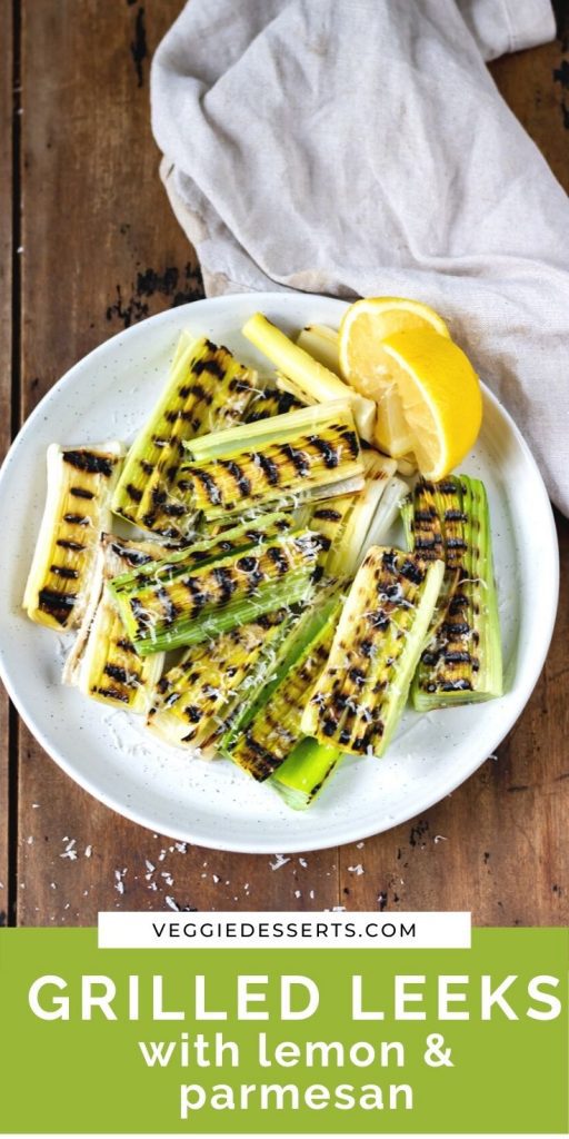 Leeks on a plate with text: Grilled Leeks with lemon and parmesan.