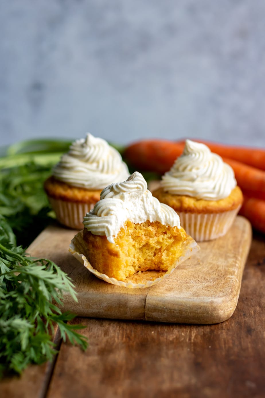 Close up of a cupcake with a bite out.