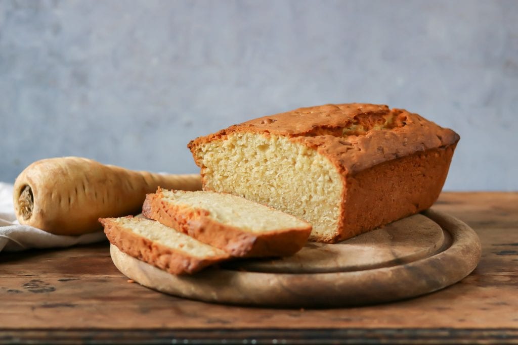 wide view of a loaf cake cut into slices.