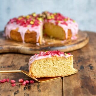 Close up of a slice of pomegranate cake.