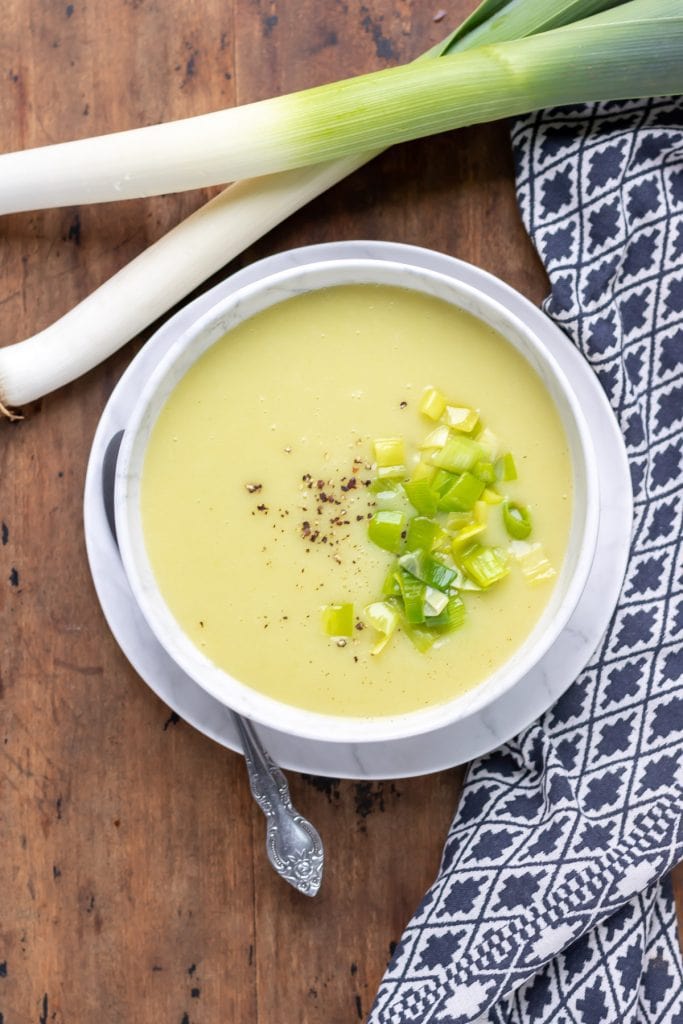 Bowl of soup with cooked leeks.