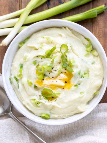 Bowl of mash with spring onions.
