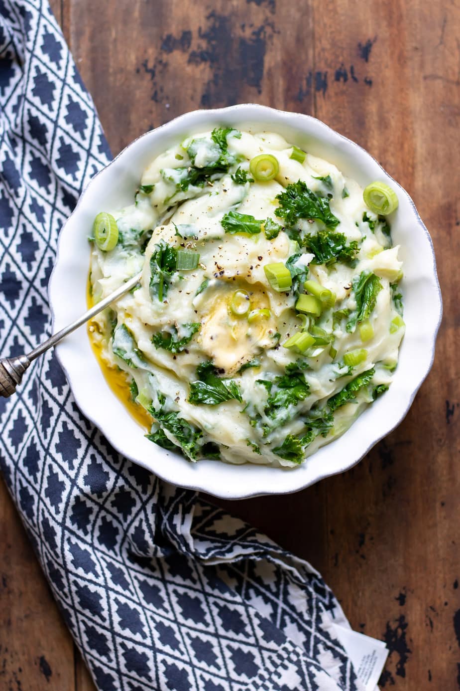 Dish of Irish colcannon with kale and butter melting on top.
