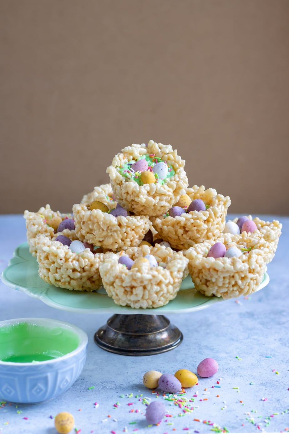 Serving platter with rice crispie treats shaped into nests.