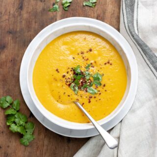 Soup in a bowl with a spoon.