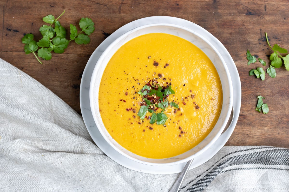 Bowl of soup on a wooden table.