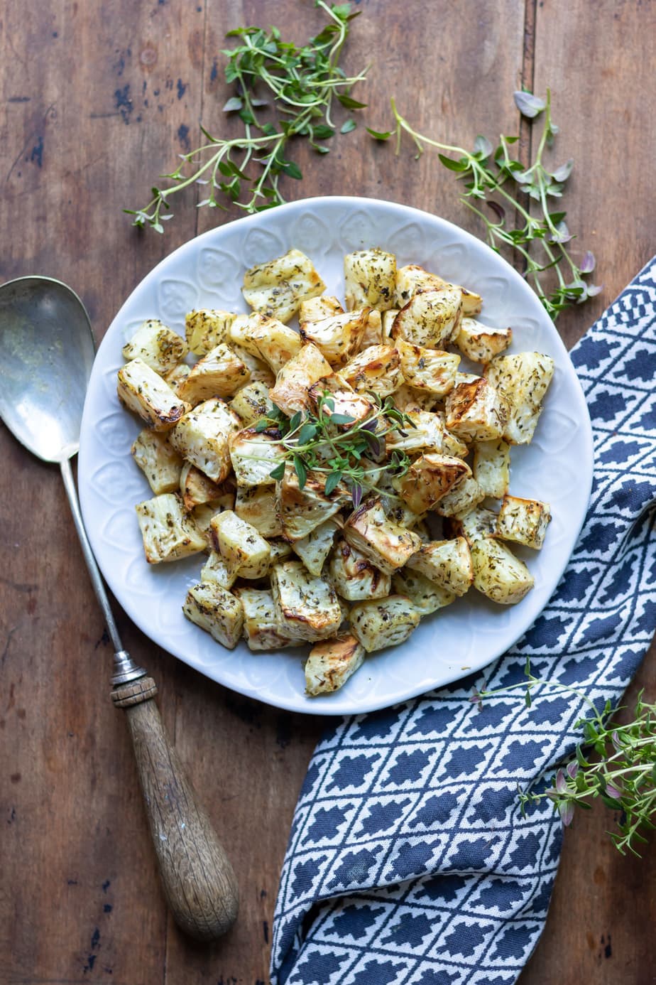 Table with a bowl of celeriac that's roasted.