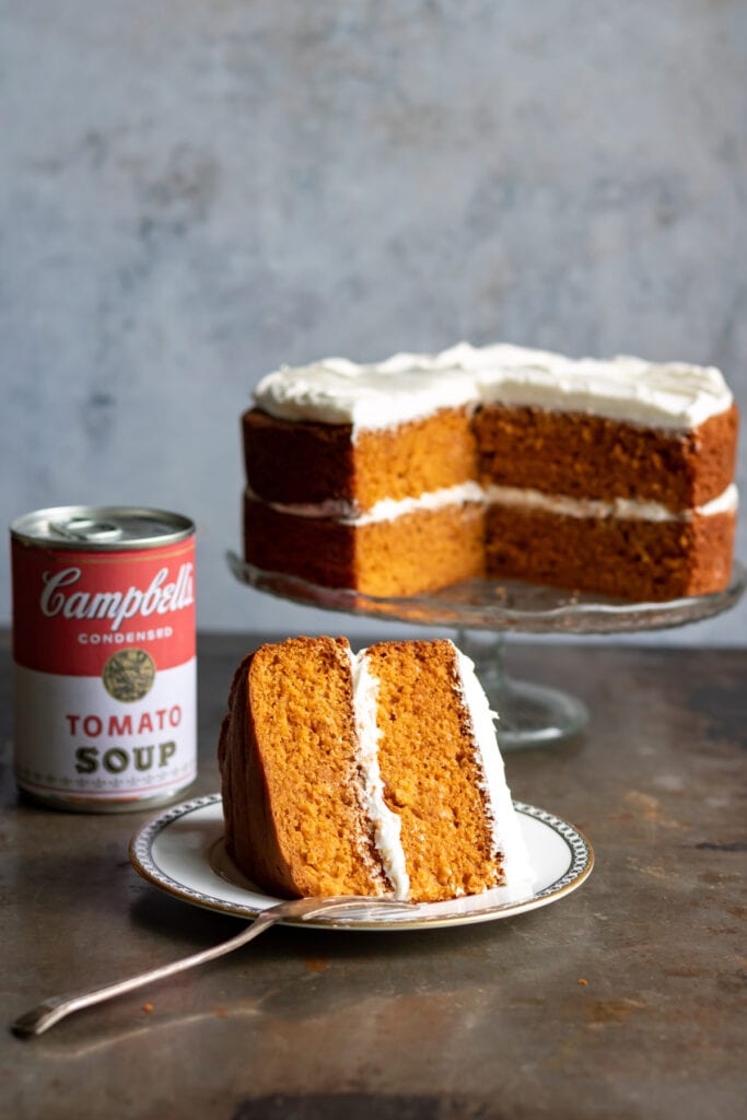 Slice of cake in front of whole cake.