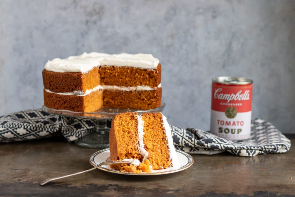 Slice of cake in front of the cake.
