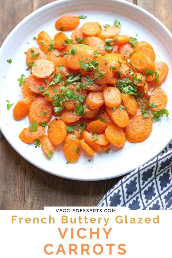 Serving dish of cooked carrots with text: Vichy Carrots.