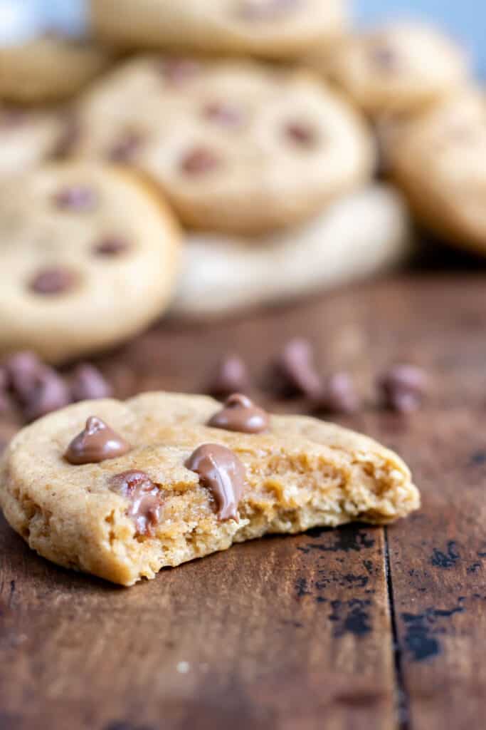 Close up of a cookie with a bite out.