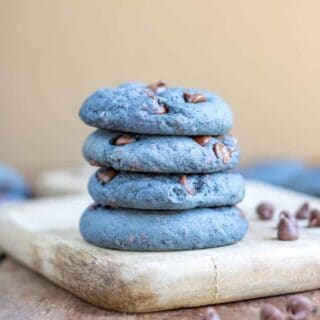 Stack of cookies on a wooden board.