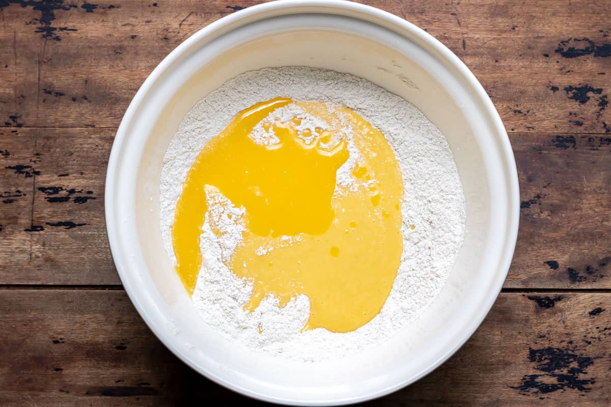 Bowl of flour, mango puree and melted butter.