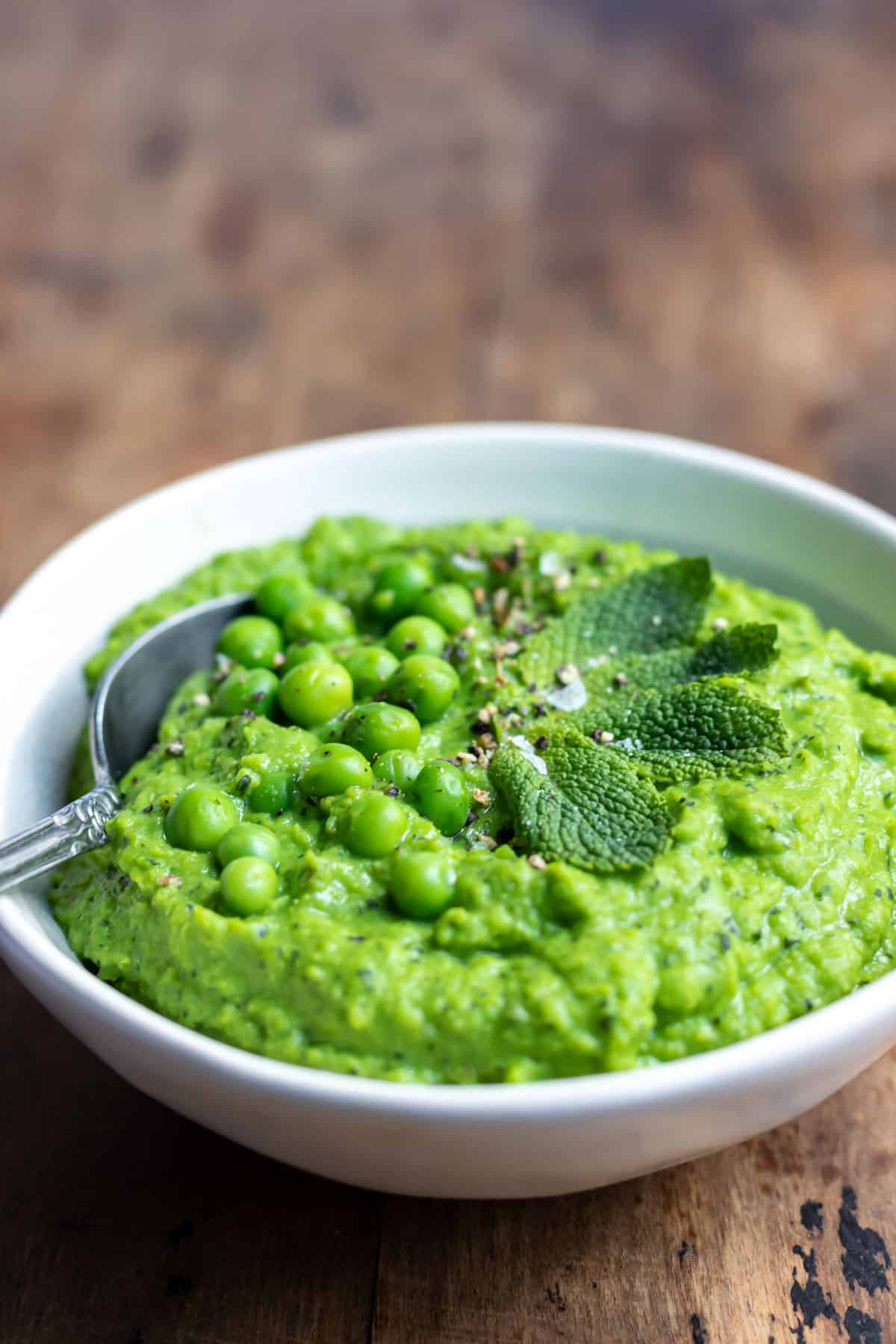 Close up of a dish of blended peas.