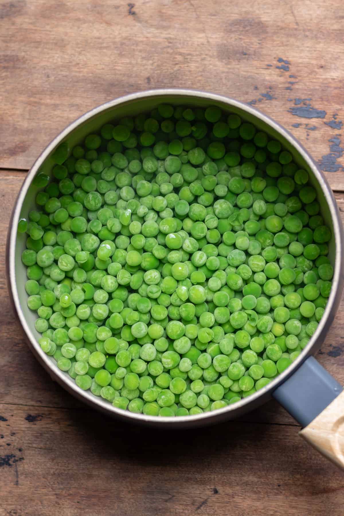 Peas boiling in a pot.