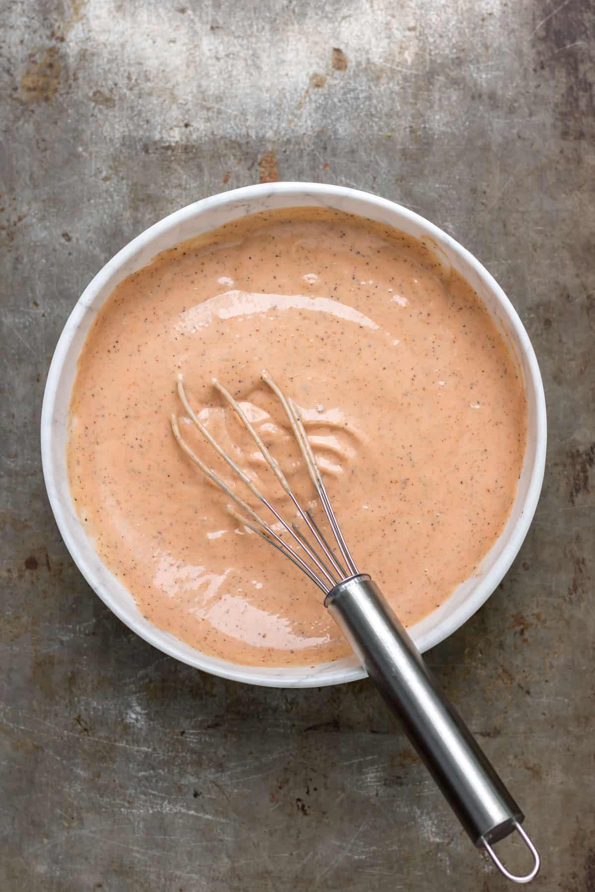 Sauce whisked in a bowl.
