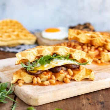 Waffles full of breakfast foods like a sandwich.