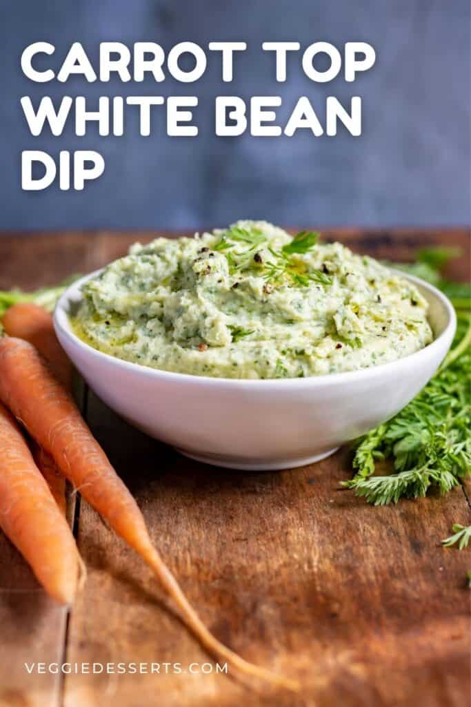 Table with dip and carrots, with text: Carrot Top White Bean Dip.