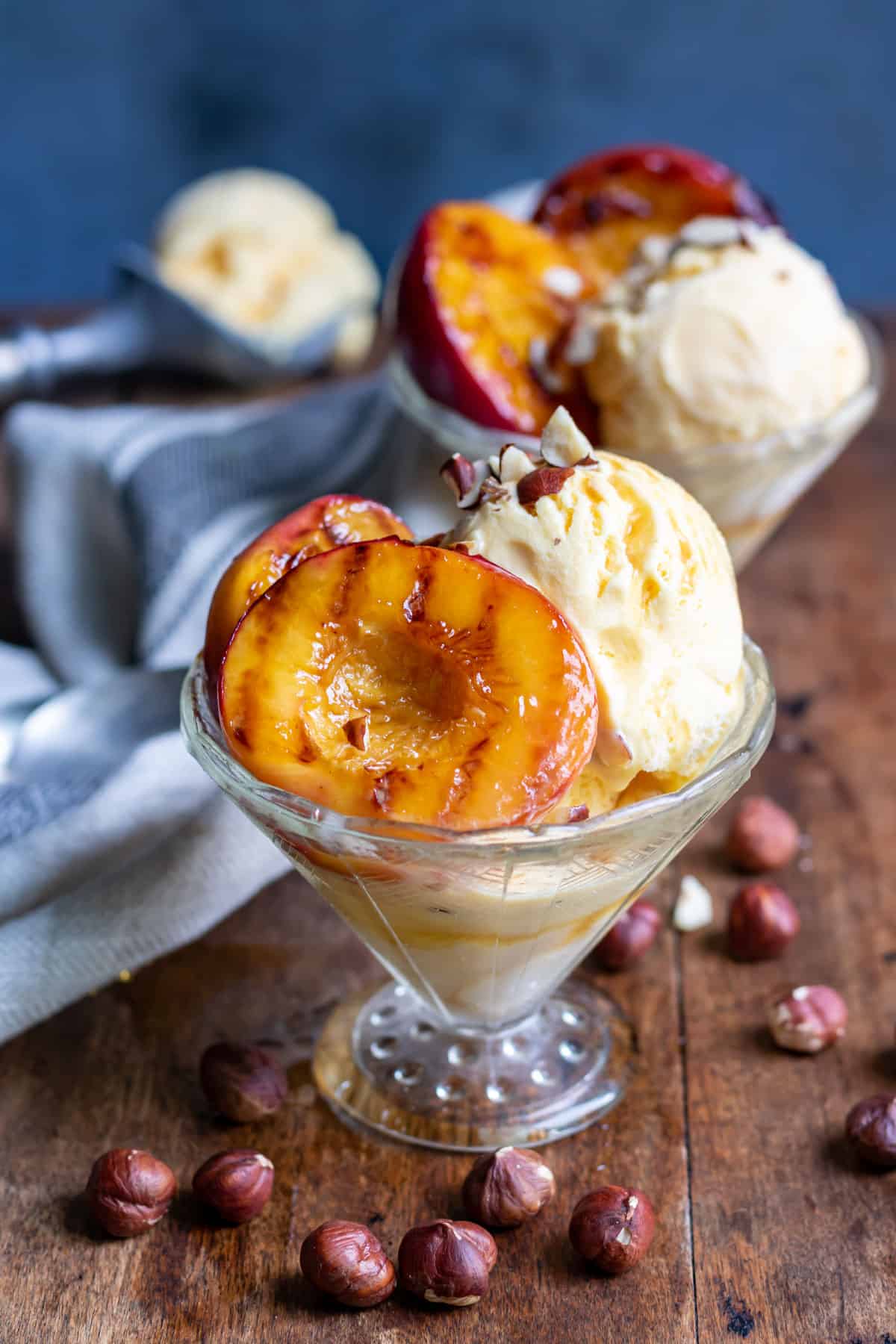 Bowls of ice cream with nectarines.