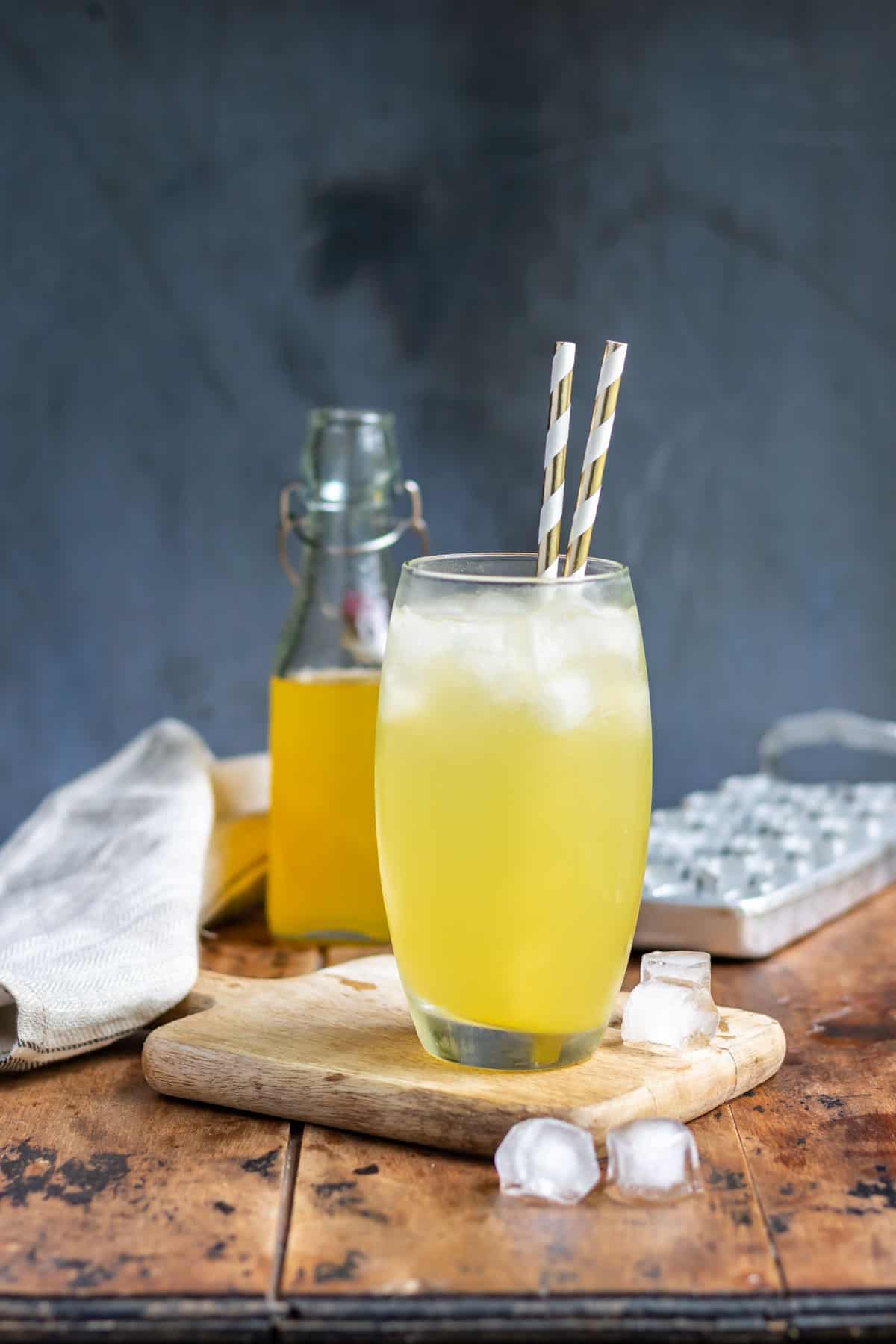 Glass of soda with mango syrup.
