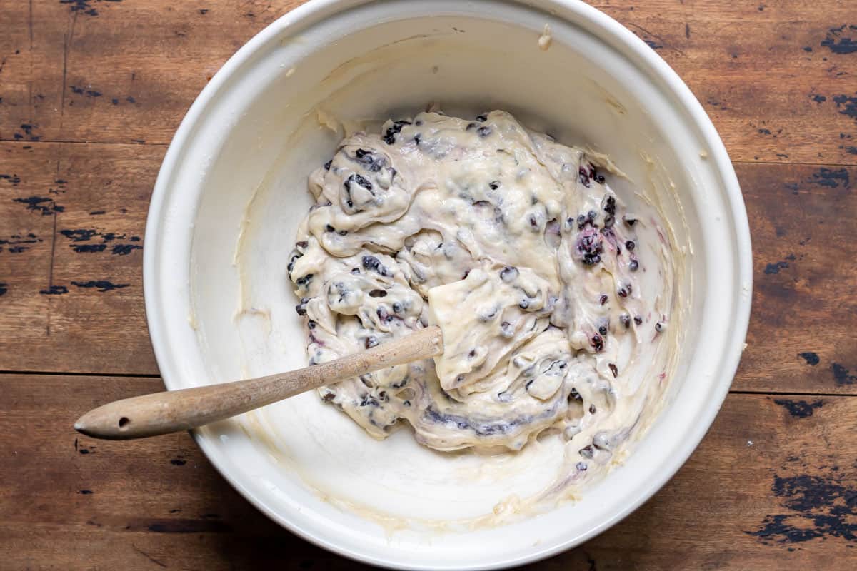 Blackberry muffin batter in a mixing bowl.
